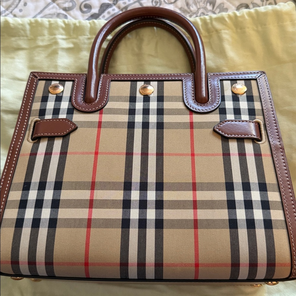 Burberry archive beige all baby tittle handbag.